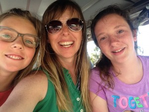 Riding the golf cart with my two big girls